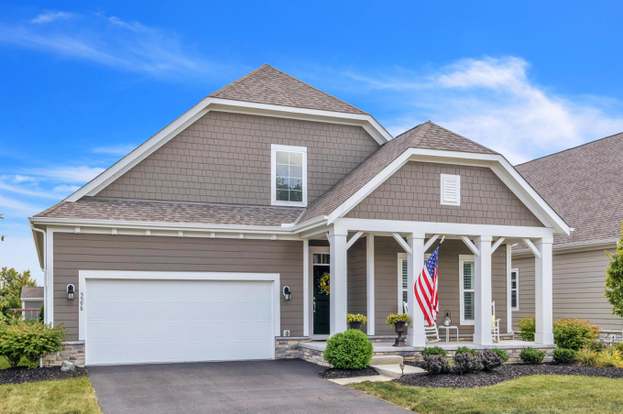 Rhonda See assisting a home buyer, showcasing her deep understanding of Central Ohio's property landscape.